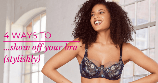 woman wearing navy blue bra and suspender set